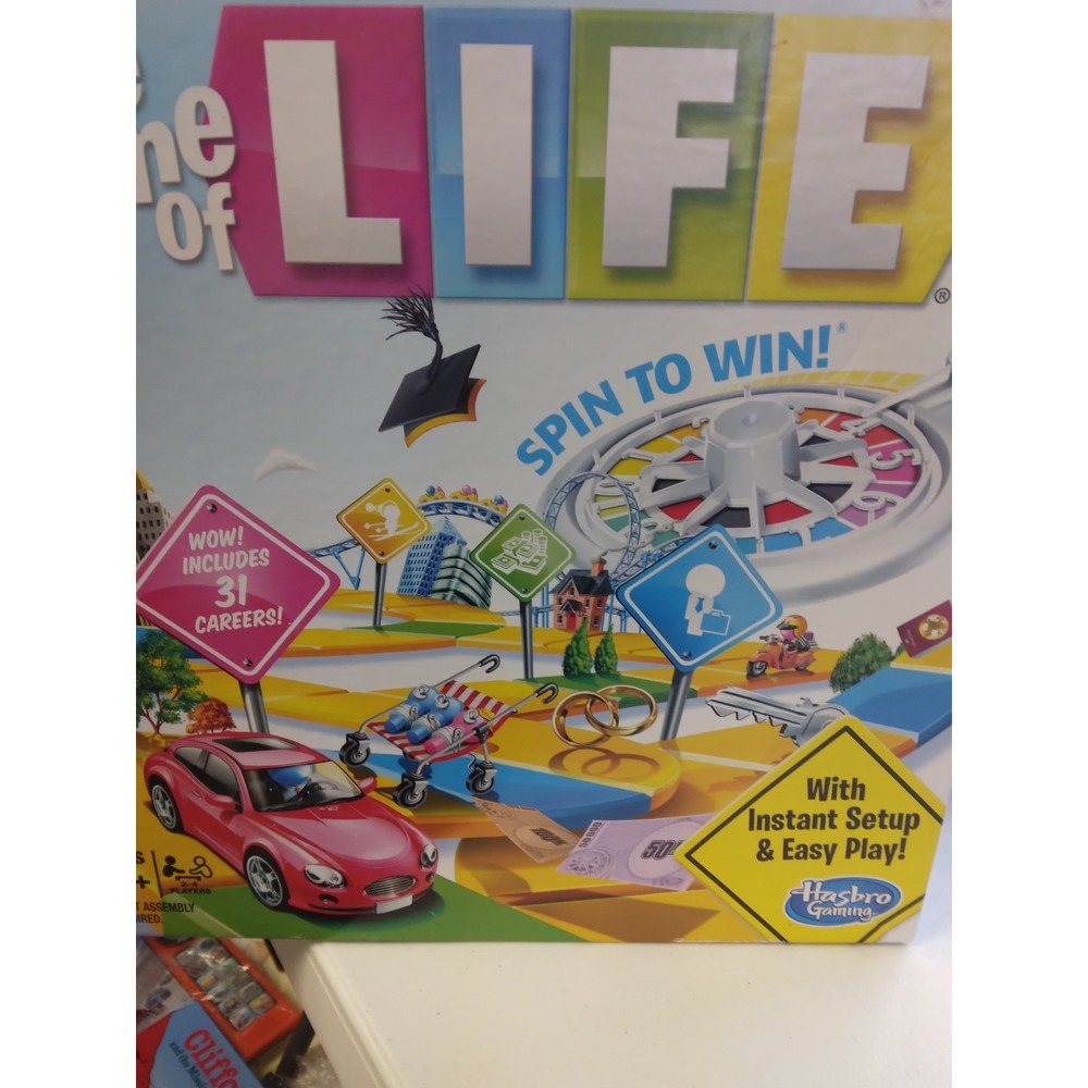 The Game of Life spin to win Hasbro ages 8 and up